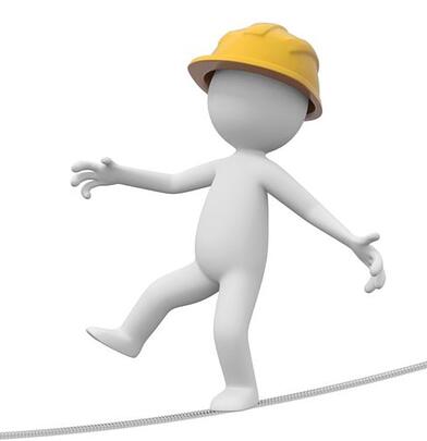 figure balancing on tightrope with a hardhat on