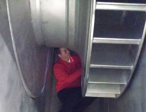 Man fixing industrial fan